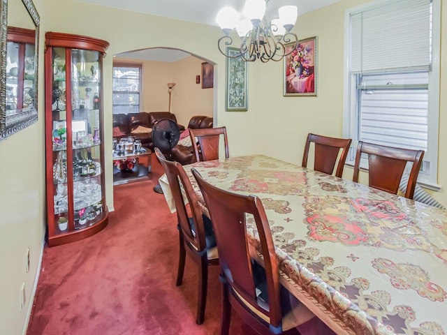4431 Matilda Ave, Bronx, NY 10470 - carpeted dining area featuring arched walkways and a chandelier