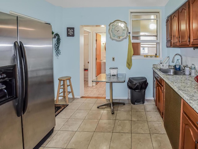 4431 Matilda Ave, Bronx, NY 10470 - kitchen with stainless steel refrigerator with ice dispenser and light tile patterned floors