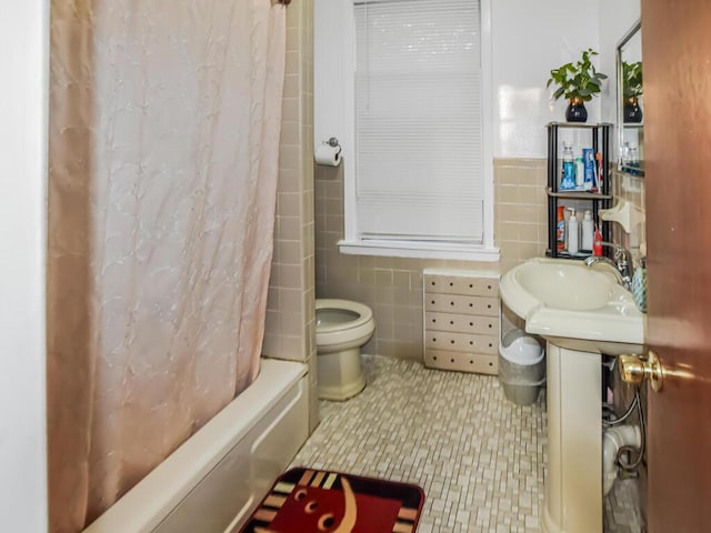 4431 Matilda Ave, Bronx, NY 10470 - full bathroom featuring tile walls, shower / bath combo with shower curtain, and a wainscoted wall