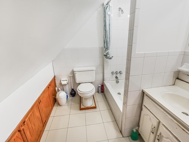 4431 Matilda Ave, Bronx, NY 10470 - bathroom featuring tile walls, vanity, tile patterned flooring, shower / bathtub combination with curtain, and a wainscoted wall