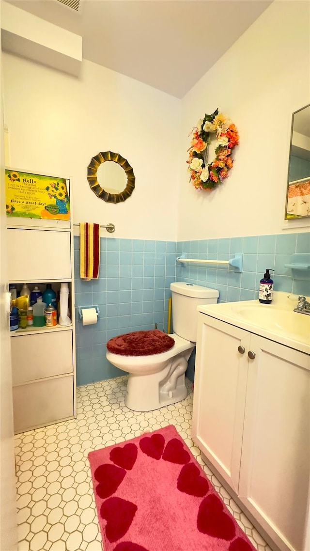 26 Cooper Unit 314, Poughkeepsie, NY 12603 - bathroom featuring tile walls, vanity, and wainscoting