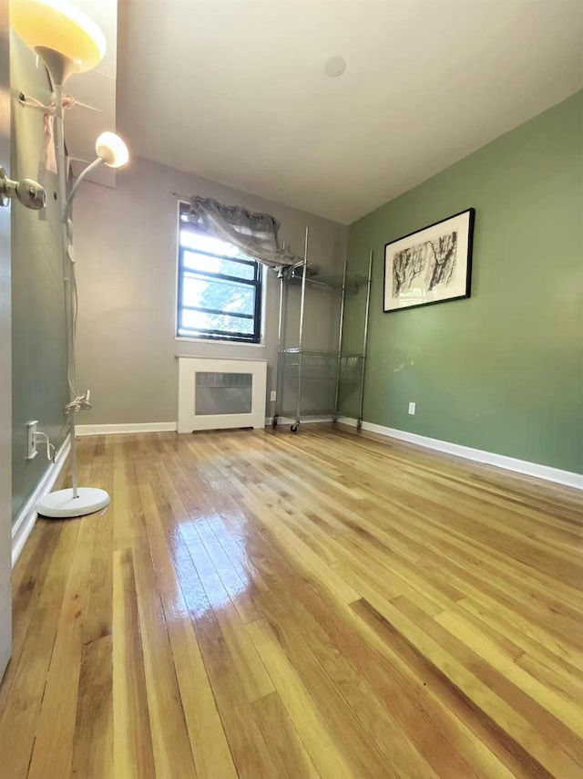 13523 135th Unit A, Kew Garden Hills, NY 11367 - unfurnished living room with hardwood / wood-style floors and baseboards