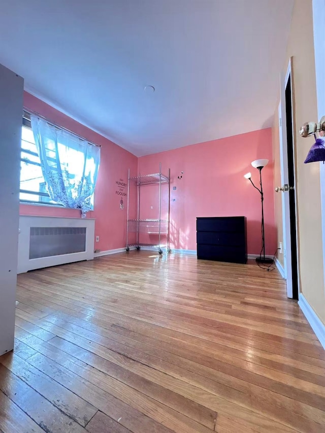 13523 135th Unit A, Kew Garden Hills, NY 11367 - unfurnished living room featuring hardwood / wood-style flooring and baseboards
