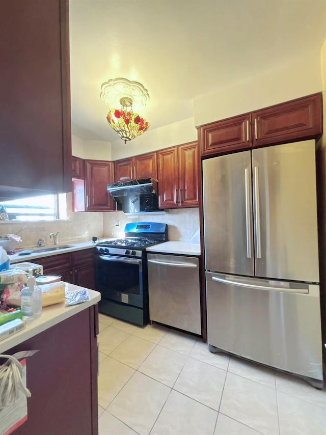 13523 135th Unit A, Kew Garden Hills, NY 11367 - kitchen with stainless steel appliances, exhaust hood, light countertops, tasteful backsplash, and light tile patterned floors