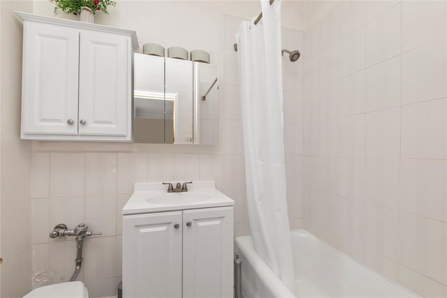 160-15 Powells Cove Blvd Unit A1, Whitestone, NY 11357 - full bath with vanity, shower / bath combo, and tile walls