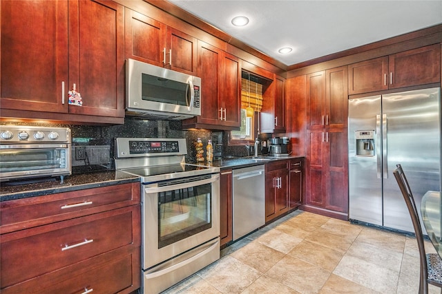 1334 Thompson Dr, Bay Shore, NY 11706 - kitchen with stainless steel appliances, dark brown cabinets, tasteful backsplash, and recessed lighting