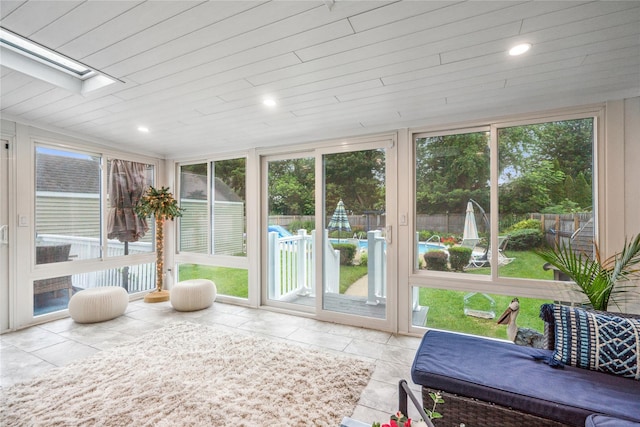 1334 Thompson Dr, Bay Shore, NY 11706 - sunroom / solarium featuring healthy amount of natural light, wood ceiling, and a skylight