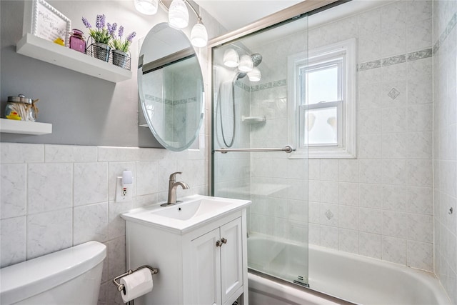 1334 Thompson Dr, Bay Shore, NY 11706 - bathroom with vanity, tub / shower combination, and tile walls