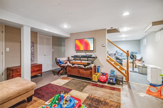 1334 Thompson Dr, Bay Shore, NY 11706 - living area featuring concrete flooring and recessed lighting