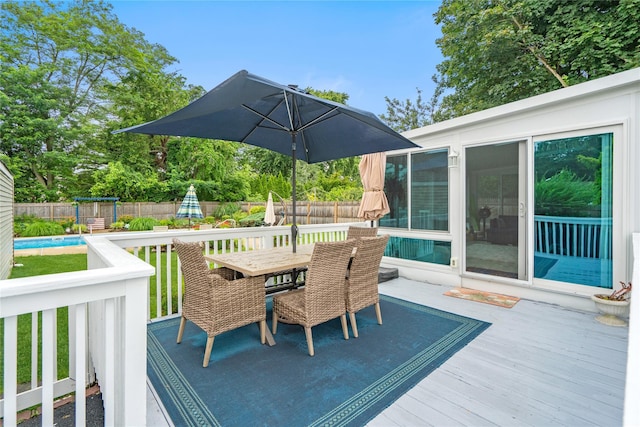1334 Thompson Dr, Bay Shore, NY 11706 - wooden terrace featuring outdoor dining area and a fenced backyard