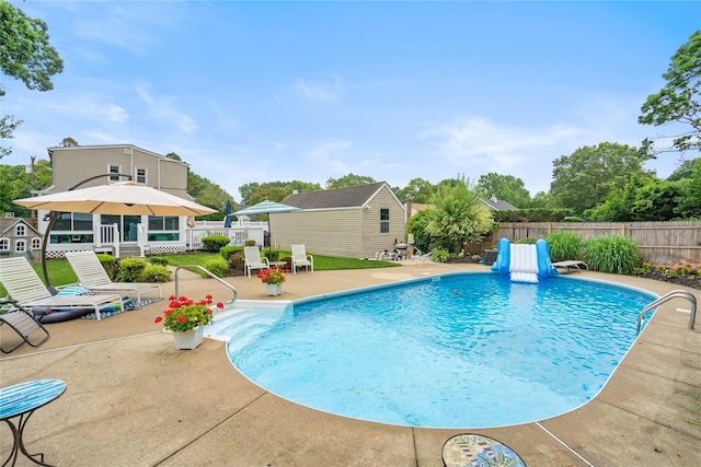 1334 Thompson Dr, Bay Shore, NY 11706 - view of pool with a patio area, a fenced backyard, and a shed