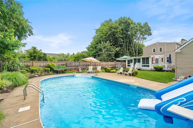 1334 Thompson Dr, Bay Shore, NY 11706 - view of swimming pool with a fenced backyard, a patio area, a water slide, and a sunroom