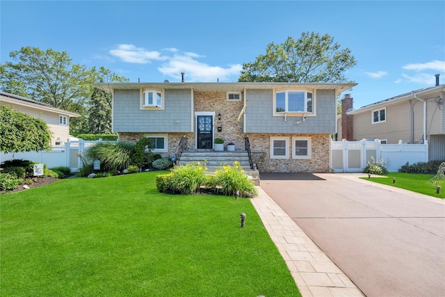 318 Claremont Ave, West Babylon, NY 11704 - raised ranch with concrete driveway and stone siding