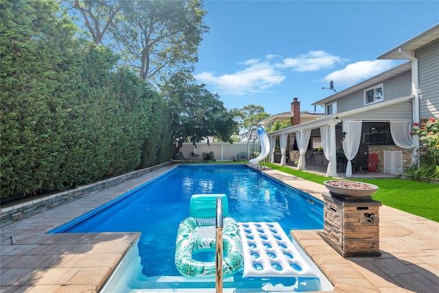 318 Claremont Ave, West Babylon, NY 11704 - view of pool featuring a water slide, a patio, a fenced backyard, and stairway