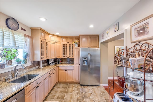 318 Claremont Ave, West Babylon, NY 11704 - kitchen with appliances with stainless steel finishes, light stone countertops, glass insert cabinets, recessed lighting, and light brown cabinets