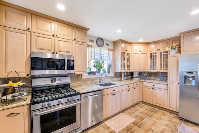 318 Claremont Ave, West Babylon, NY 11704 - kitchen featuring stainless steel appliances, tasteful backsplash, glass insert cabinets, light stone counters, and recessed lighting