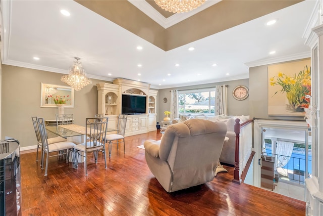 318 Claremont Ave, West Babylon, NY 11704 - living room with a chandelier, hardwood / wood-style flooring, recessed lighting, and ornamental molding