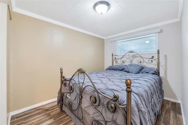 318 Claremont Ave, West Babylon, NY 11704 - bedroom with wood finished floors and ornamental molding