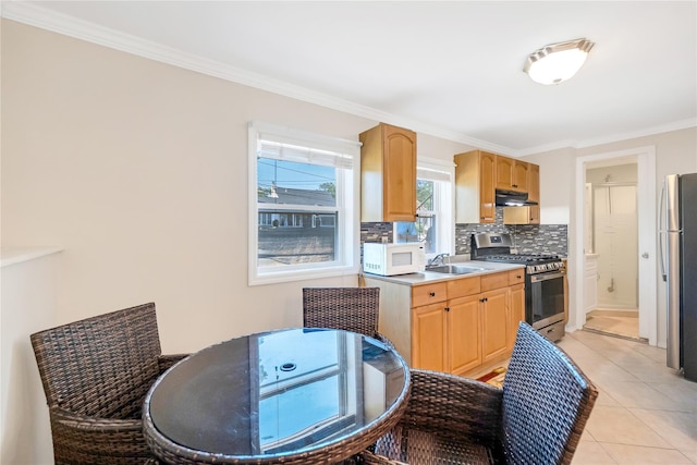 318 Claremont Ave, West Babylon, NY 11704 - kitchen featuring stainless steel appliances, under cabinet range hood, decorative backsplash, crown molding, and light brown cabinets