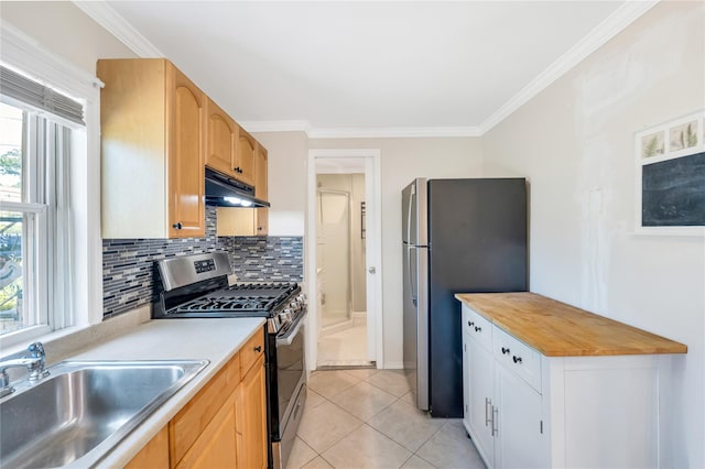 318 Claremont Ave, West Babylon, NY 11704 - kitchen with appliances with stainless steel finishes, under cabinet range hood, decorative backsplash, ornamental molding, and light tile patterned floors