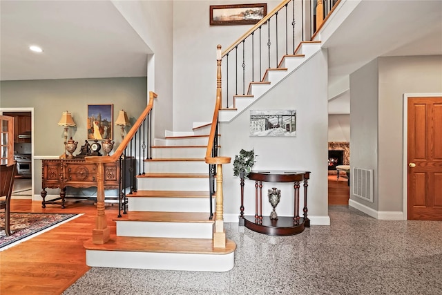 8 Hamlet Way, Hopewell Junction, NY 12533 - staircase featuring a warm lit fireplace and recessed lighting
