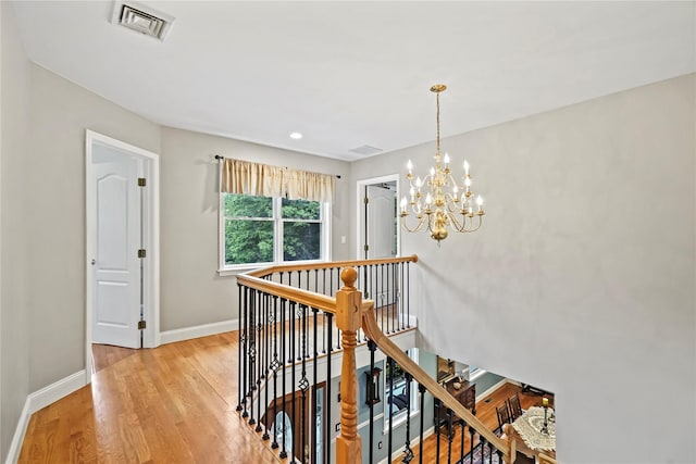 8 Hamlet Way, Hopewell Junction, NY 12533 - hallway featuring an upstairs landing, light wood-type flooring, a chandelier, and recessed lighting