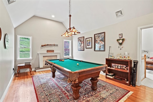 8 Hamlet Way, Hopewell Junction, NY 12533 - rec room with light wood finished floors, billiards table, vaulted ceiling, and a fireplace with raised hearth