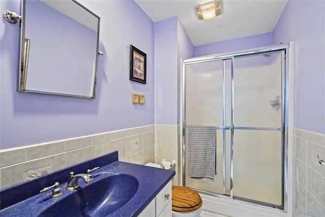 8 Hamlet Way, Hopewell Junction, NY 12533 - bathroom featuring tile walls, a shower stall, vanity, and a wainscoted wall