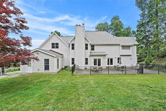 8 Hamlet Way, Hopewell Junction, NY 12533 - rear view of house with a chimney, a patio area, a shingled roof, and stucco siding