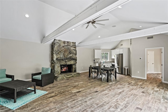 8 Hamlet Way, Hopewell Junction, NY 12533 - living room with a stone fireplace, light wood-style floors, high vaulted ceiling, a ceiling fan, and recessed lighting