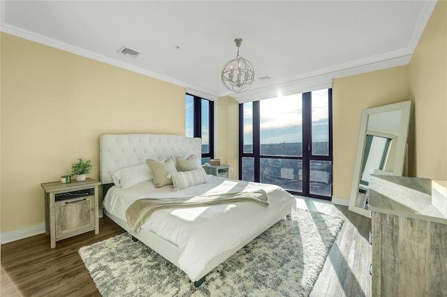 701 Rdg Hill Blvd Unit 10B, Yonkers, NY 10710 - bedroom with a chandelier, crown molding, wood finished floors, a wall of windows, and access to outside