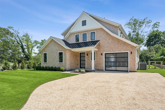 135 S Rd, Westhampton, NY 11977 - view of front of house featuring a standing seam roof, driveway, a metal roof, a garage, and covered porch