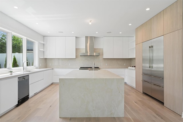 135 S Rd, Westhampton, NY 11977 - kitchen featuring open shelves, wall chimney exhaust hood, modern cabinets, stainless steel built in fridge, and recessed lighting