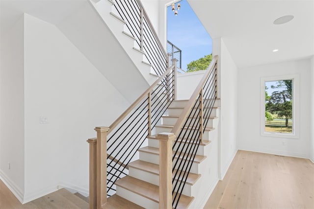 135 S Rd, Westhampton, NY 11977 - stairs featuring wood finished floors and recessed lighting