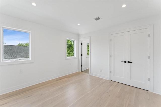 135 S Rd, Westhampton, NY 11977 - unfurnished bedroom with light wood-type flooring, recessed lighting, and a closet