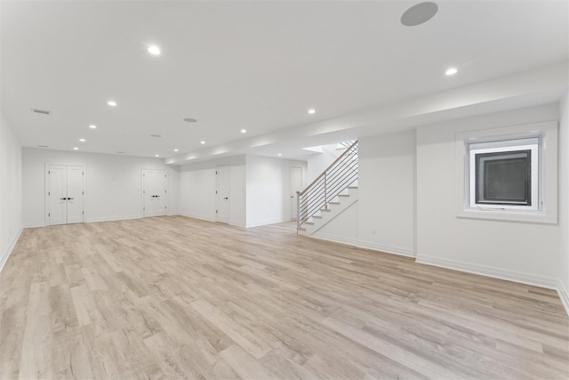 135 S Rd, Westhampton, NY 11977 - unfurnished living room with recessed lighting, stairway, and light wood-style floors
