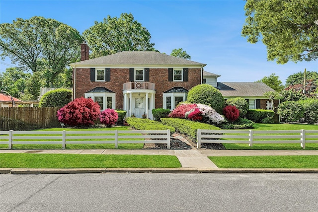 107 California Ave, Freeport, NY 11520 - colonial home with a chimney and brick siding