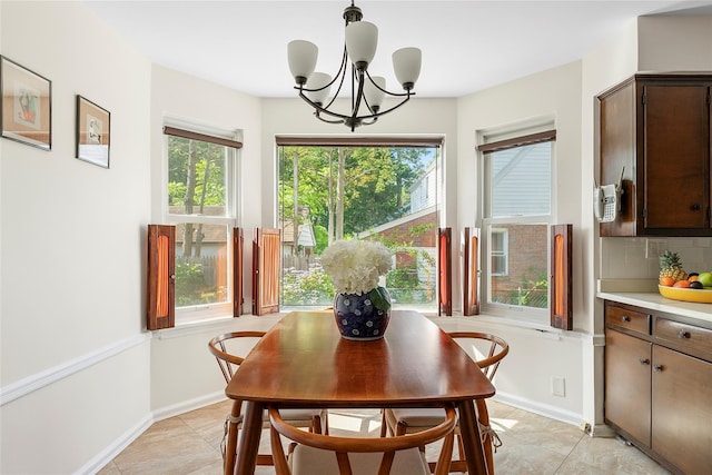 107 California Ave, Freeport, NY 11520 - dining space featuring a chandelier and light tile patterned floors