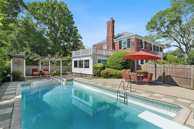 107 California Ave, Freeport, NY 11520 - view of swimming pool featuring a patio area, an outdoor structure, and a diving board