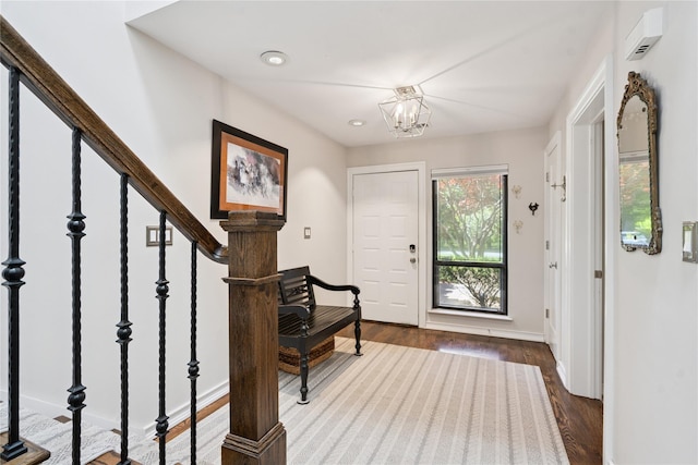 31 Boathouse Ln E, Bay Shore, NY 11706 - entrance foyer with dark wood-type flooring, a chandelier, recessed lighting, and stairway