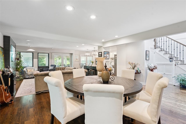 31 Boathouse Ln E, Bay Shore, NY 11706 - dining space featuring dark wood-style flooring, stairway, and recessed lighting