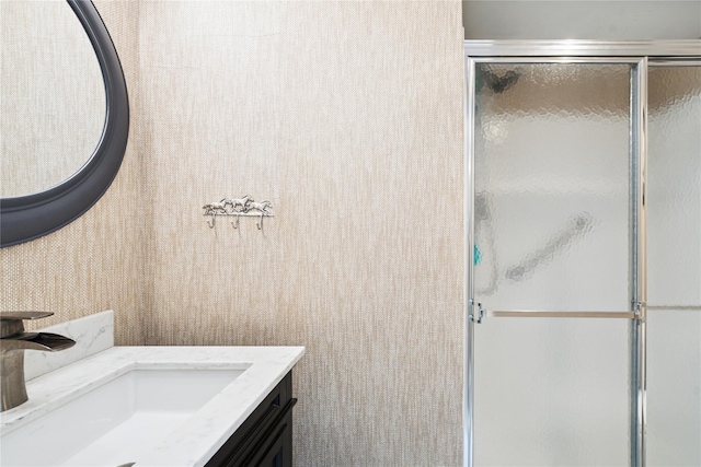 31 Boathouse Ln E, Bay Shore, NY 11706 - bathroom featuring a shower with door and vanity