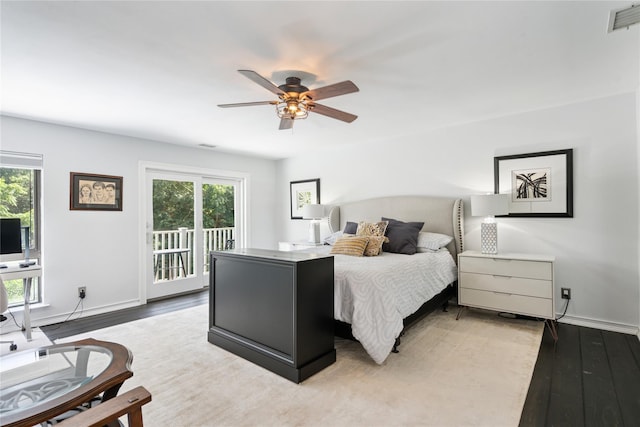 31 Boathouse Ln E, Bay Shore, NY 11706 - bedroom with light wood-type flooring, access to exterior, and a ceiling fan