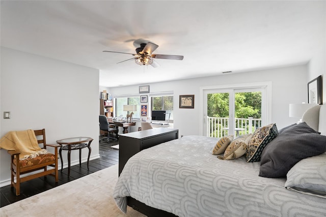 31 Boathouse Ln E, Bay Shore, NY 11706 - bedroom featuring access to exterior, dark wood finished floors, a ceiling fan, and a desk