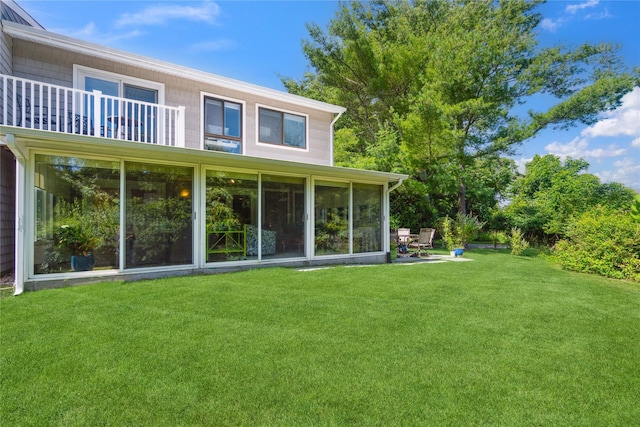 31 Boathouse Ln E, Bay Shore, NY 11706 - back of house with a lawn and a sunroom