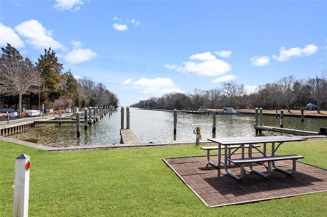 31 Boathouse Ln E, Bay Shore, NY 11706 - dock area with a water view and a yard