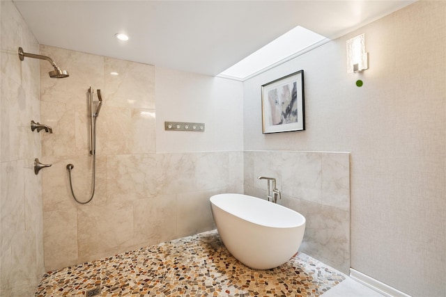 31 Boathouse Ln E, Bay Shore, NY 11706 - bathroom featuring tiled shower, tile walls, and a freestanding tub