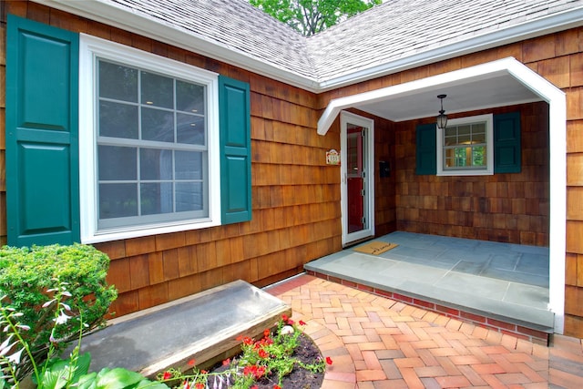 153 Park Ave, Manhasset, NY 11030 - view of exterior entry featuring a shingled roof