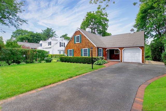 153 Park Ave, Manhasset, NY 11030 - view of front facade featuring asphalt driveway, a garage, a chimney, a front lawn, and roof with shingles