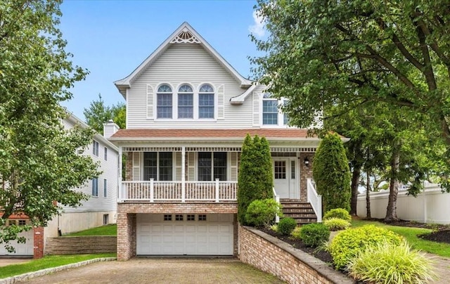 2 Apple Ct, Eastchester, NY 10709 - victorian home with driveway, an attached garage, and covered porch